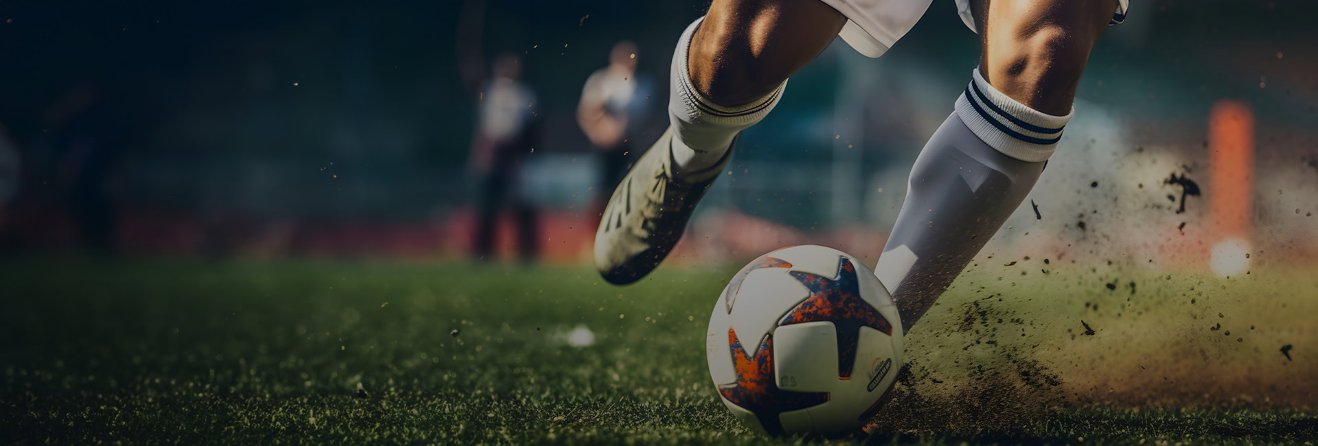 close up of a soccer player in white cleats and socks dribbling the ball